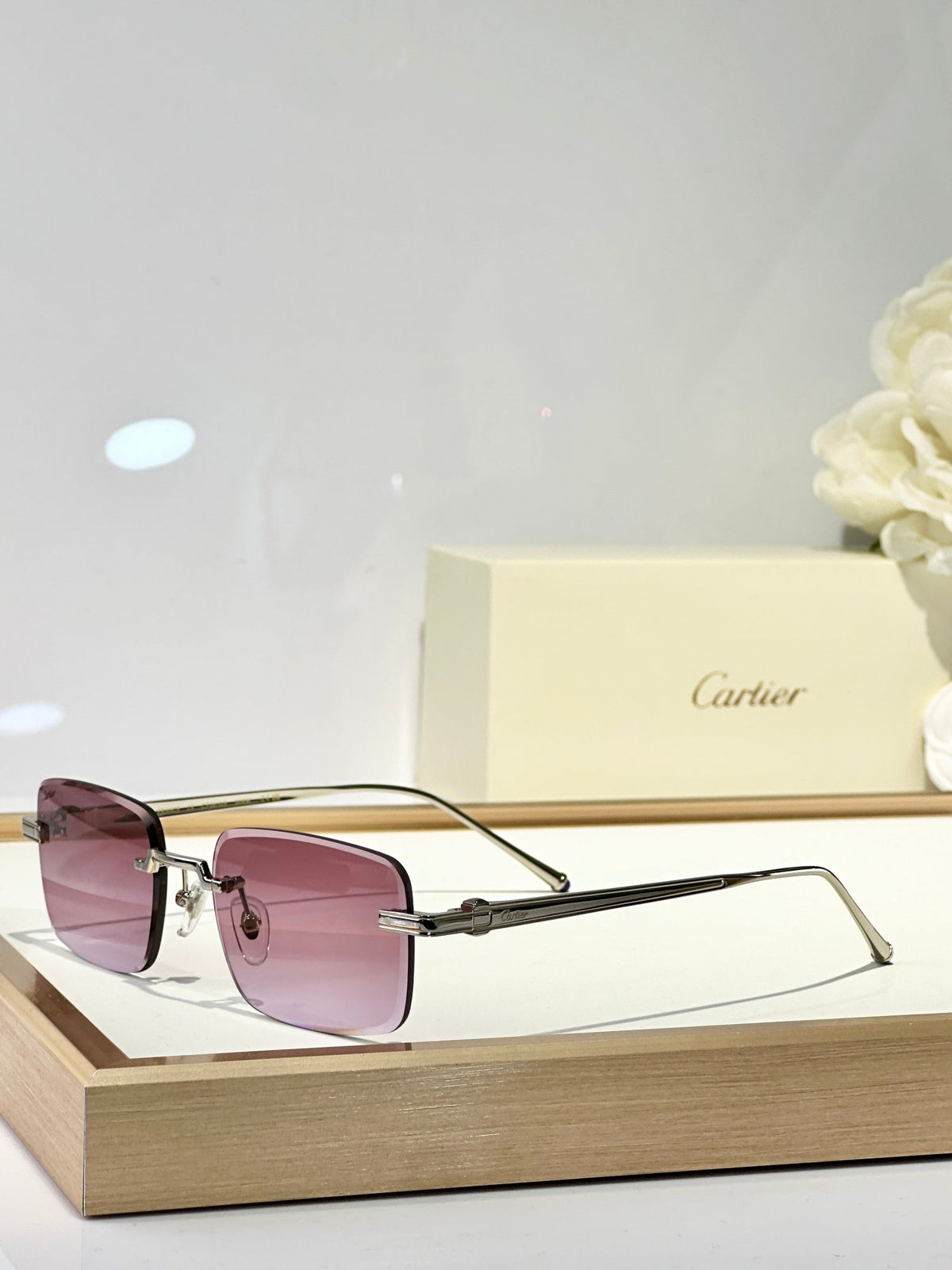 CARTIER C DE RIMLESS SQUARE FRAME SUNGLASSES CT0610S IN METAL