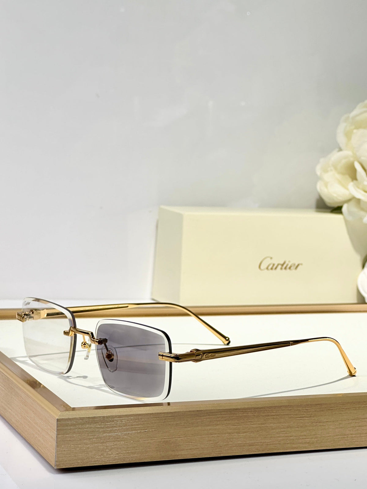 CARTIER C DE RIMLESS SQUARE FRAME SUNGLASSES CT0610S IN METAL